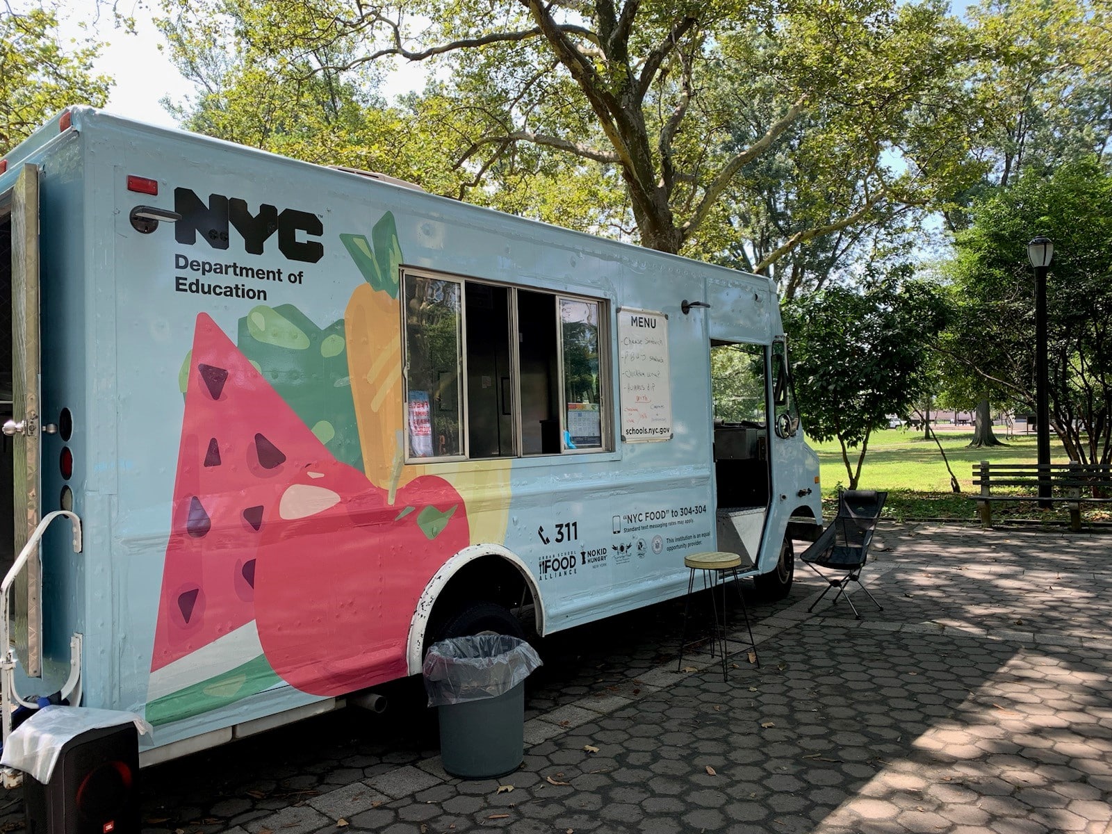 DOE Summer Meals Truck outside on a sunny day.