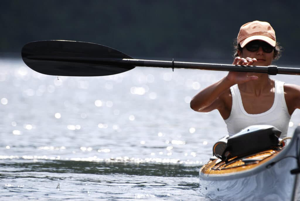 person kayaking on prospect park lake