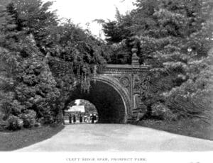 black and white photo of people under a bridge in Prospect Park