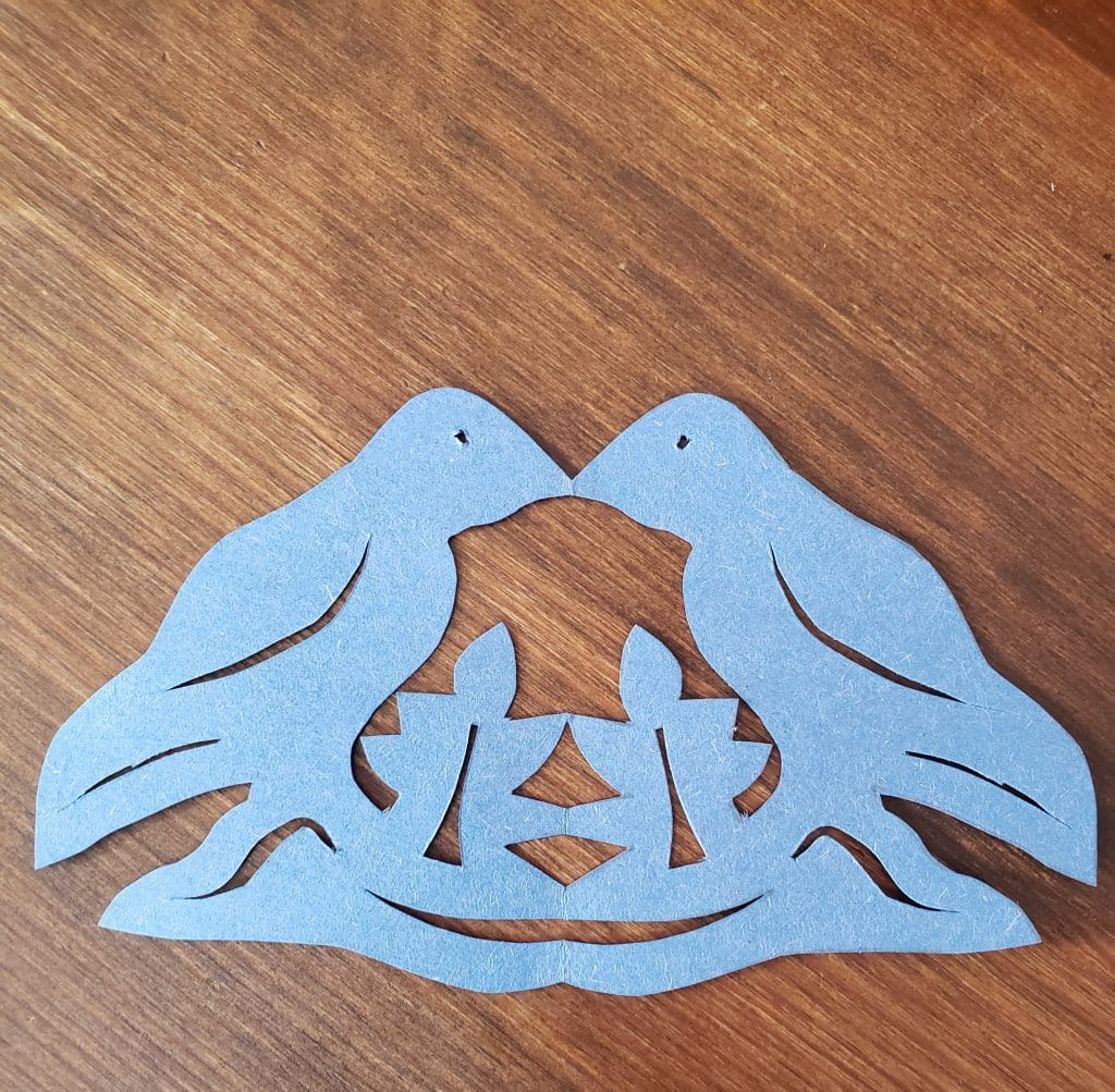 mirrored bird logo blue construction paper